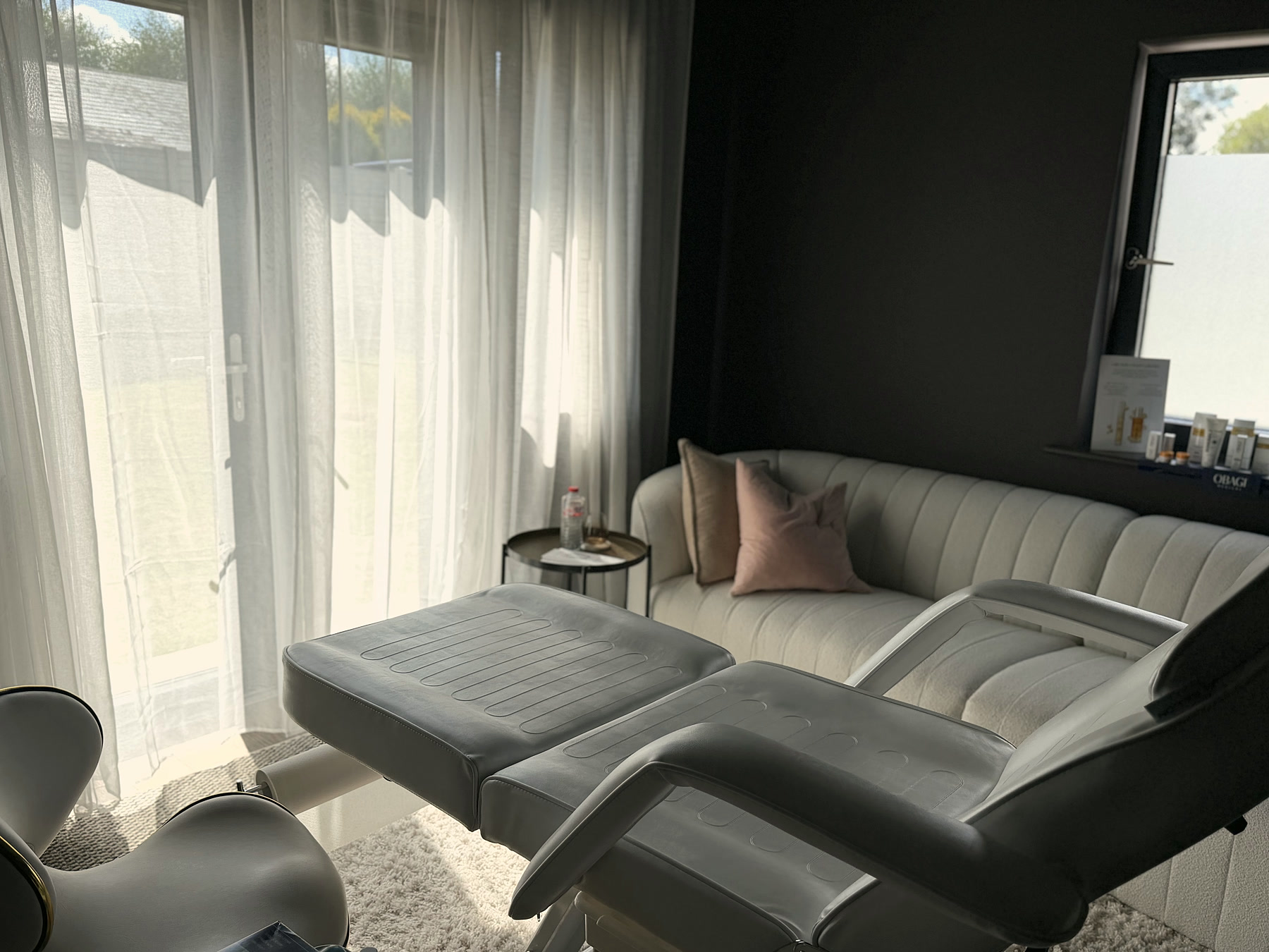 Treatment room at Lumina Aesthetics, Limerick, with Obagi Medical skincare on display